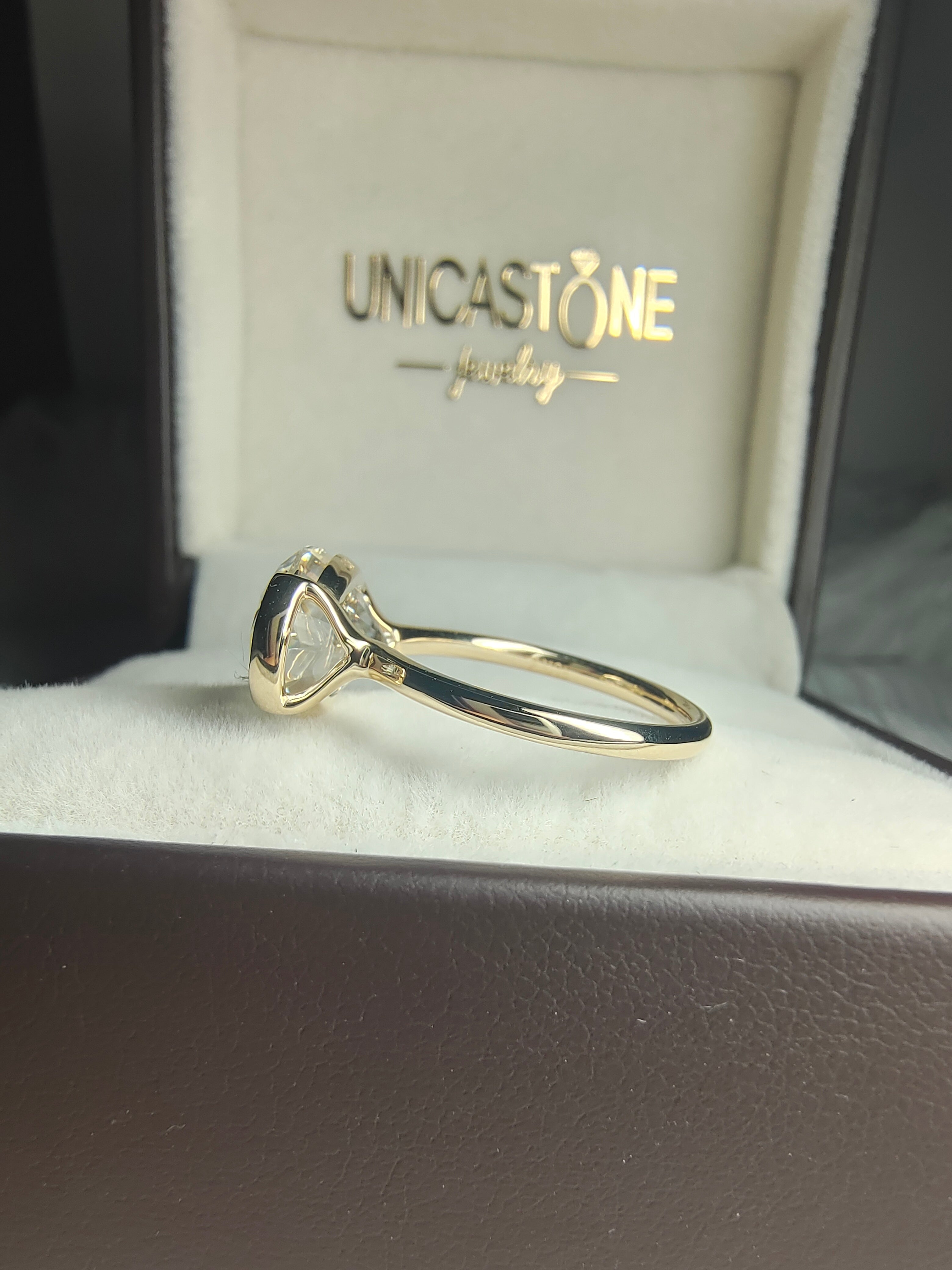 Half Bezel Oval Engagement Ring