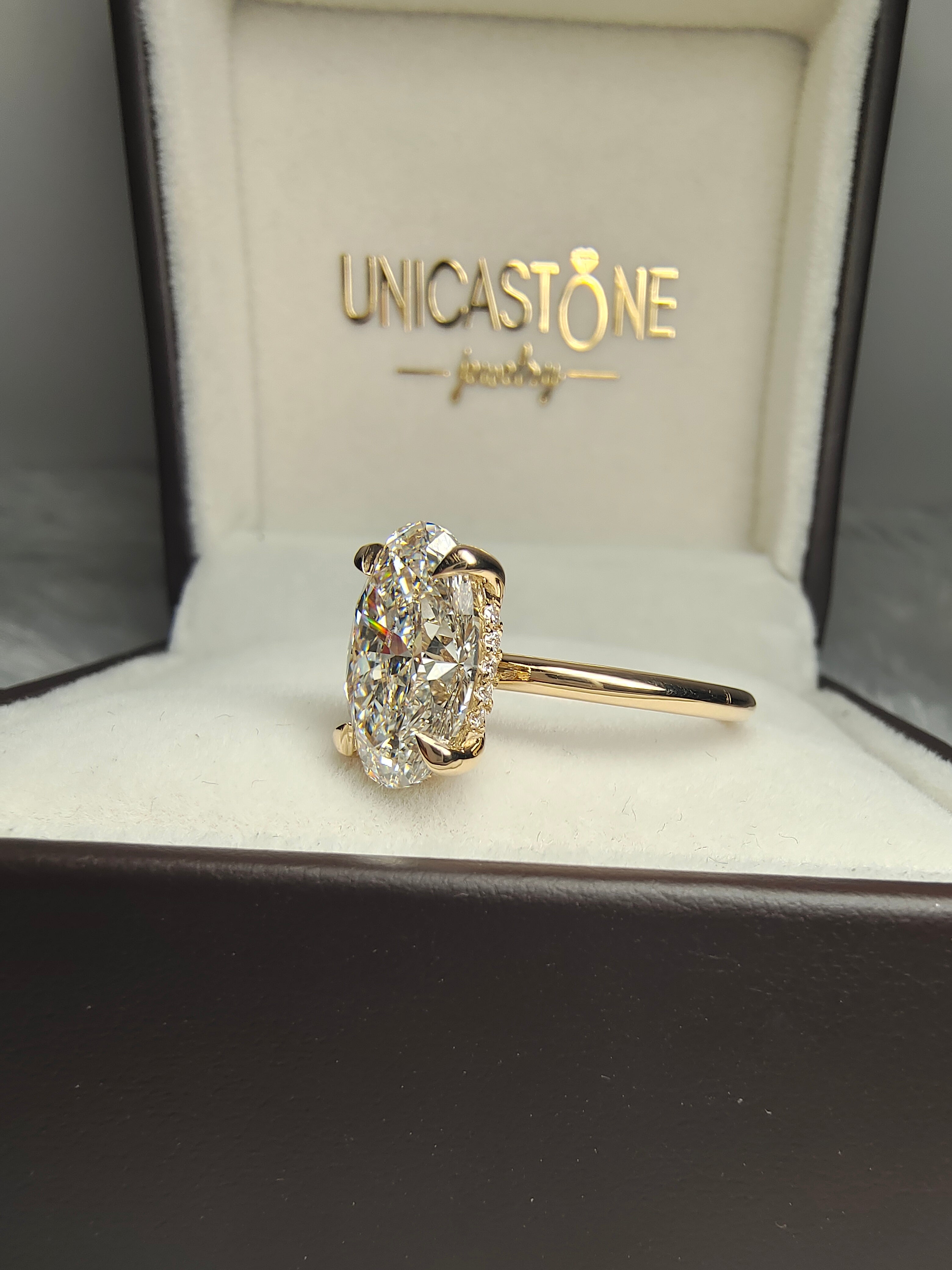 Oval Cut Hidden Halo Engagement Ring by UnicaStone