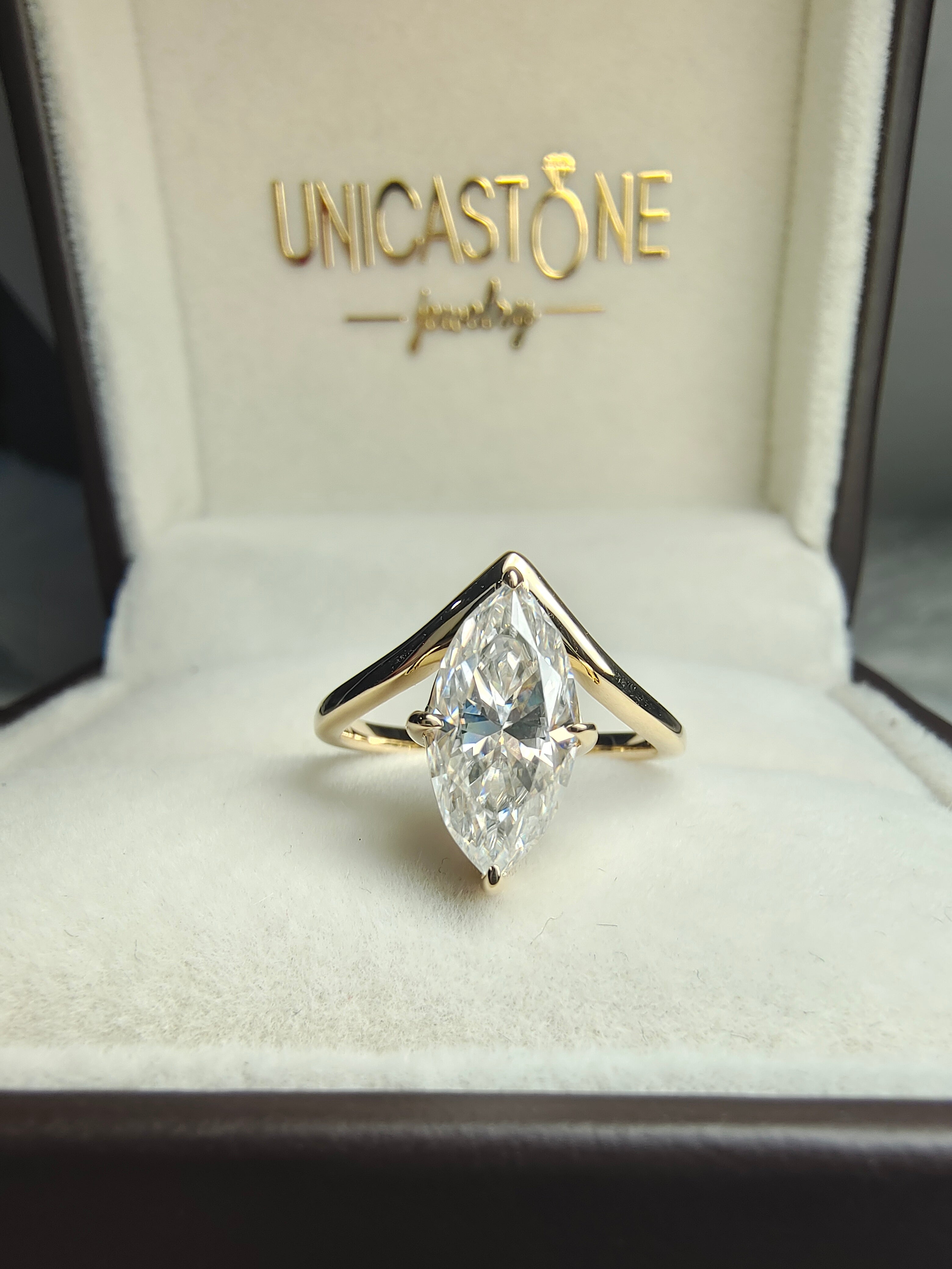 Marquise Moissanite Engagement Ring in Chevron Band Setting by UnicaStone