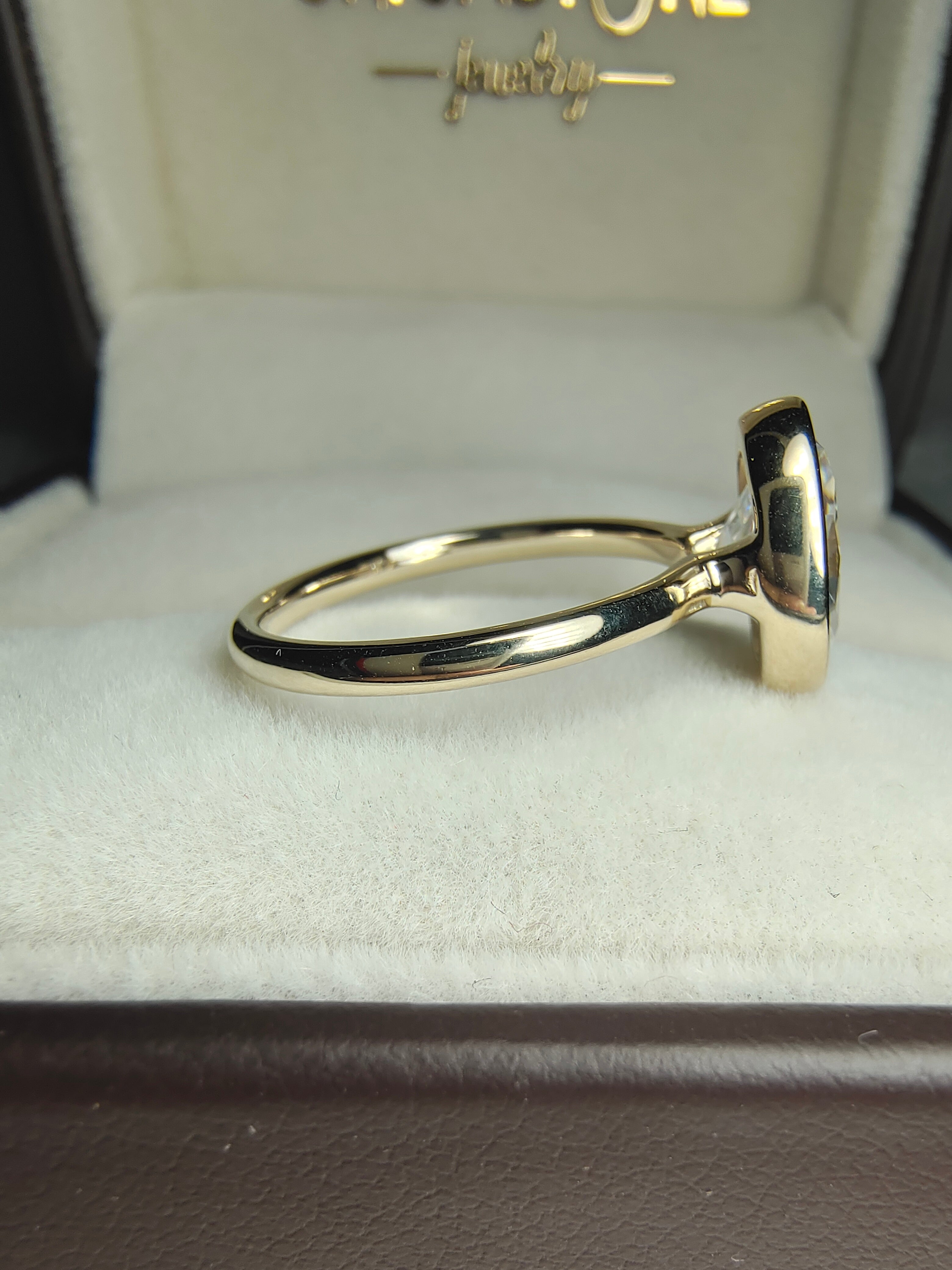 Bezel Set 2ct Oval Moissanite Engagement Ring by UnicaStone