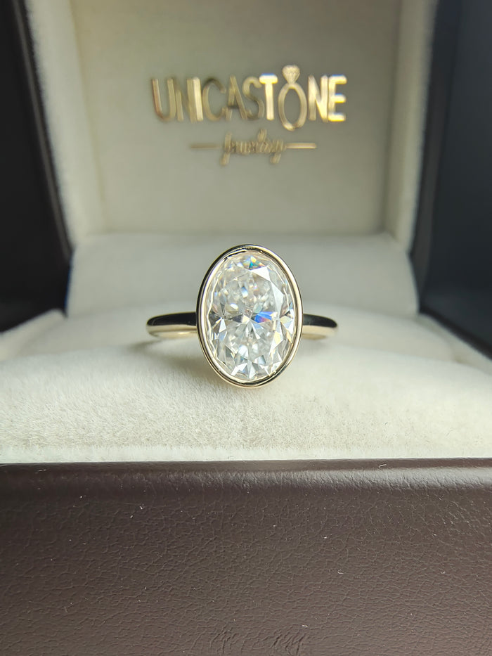 Bezel Set 2 carat Oval Moissanite Engagement Ring in 14k Yellow Gold - Open Gallery Basket Setting