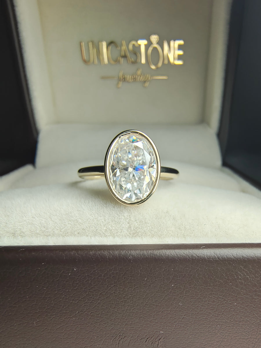 Bezel Set 2 carat Oval Moissanite Engagement Ring in 14k Yellow Gold - Open Gallery Basket Setting