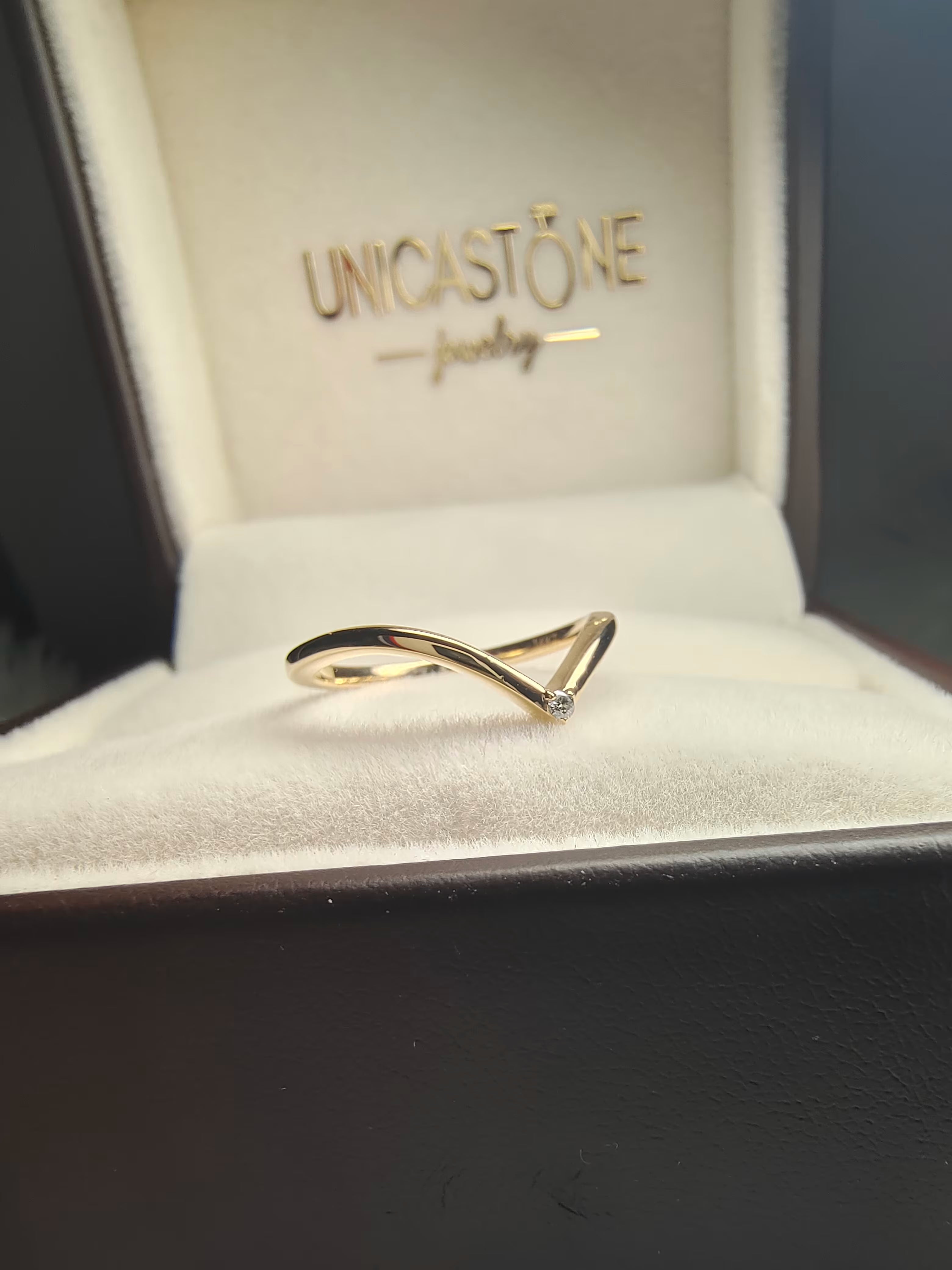 curved chevron moissanite wedding band by unicatone