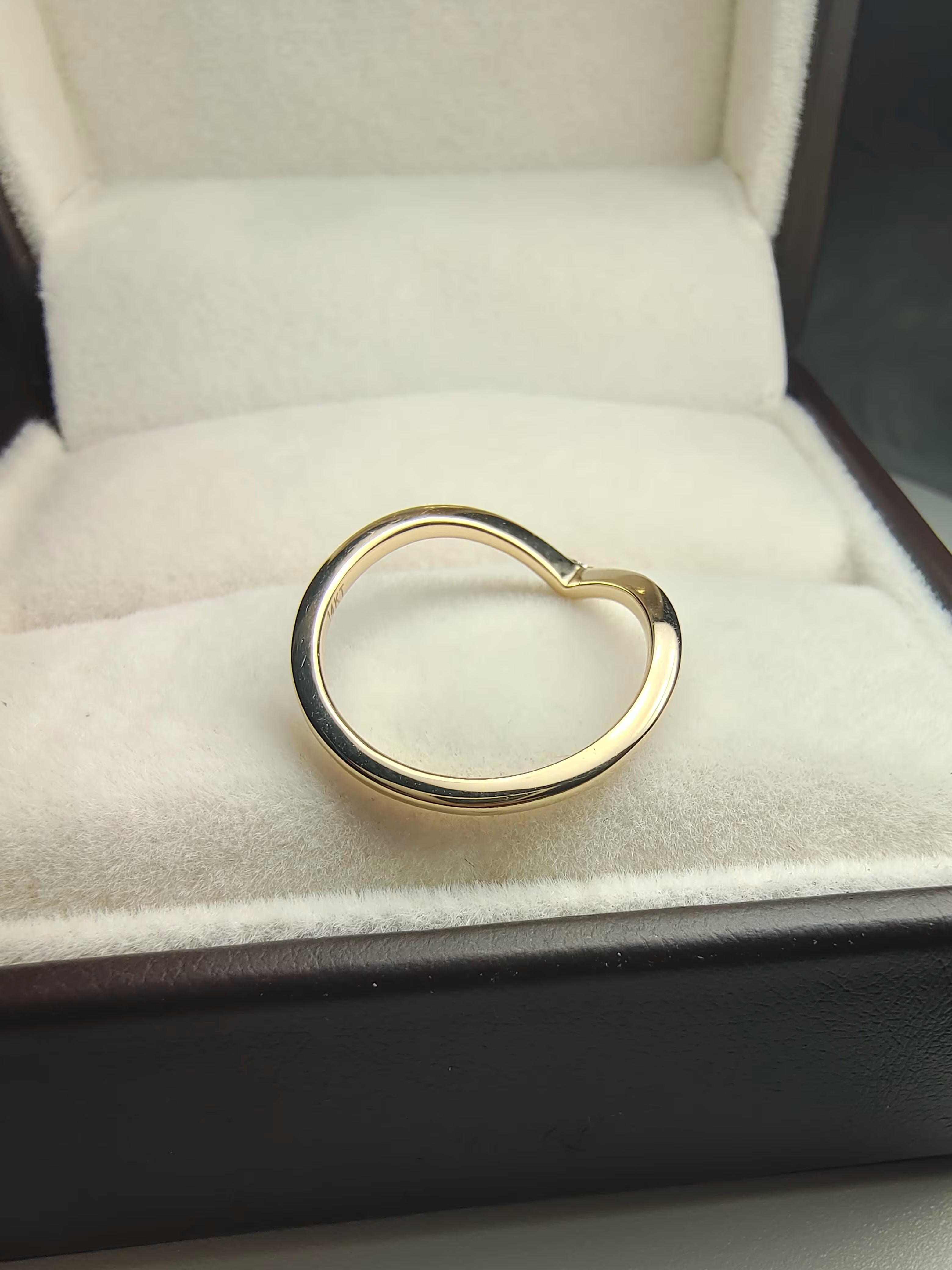 curved moissanite anniversary band by unicastone